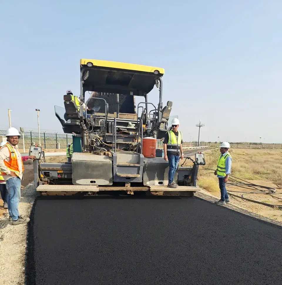 Asphalt paver at work on a plant access road