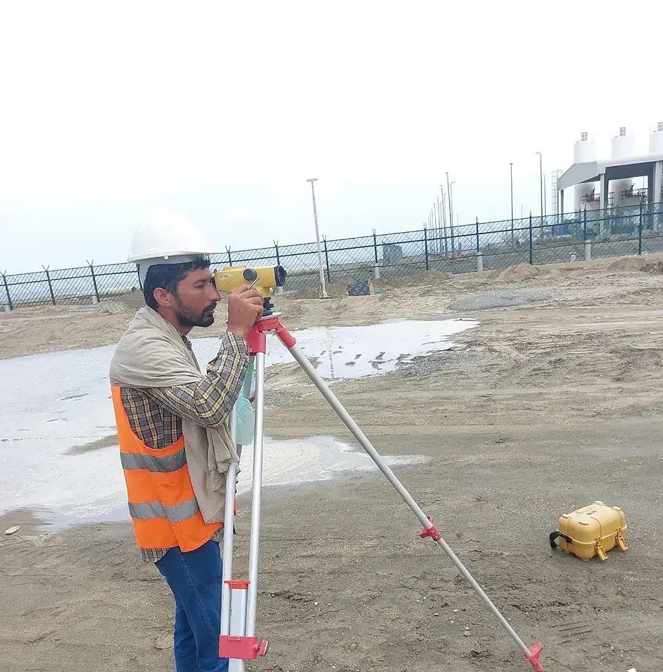 Surveyor setting out with a total station